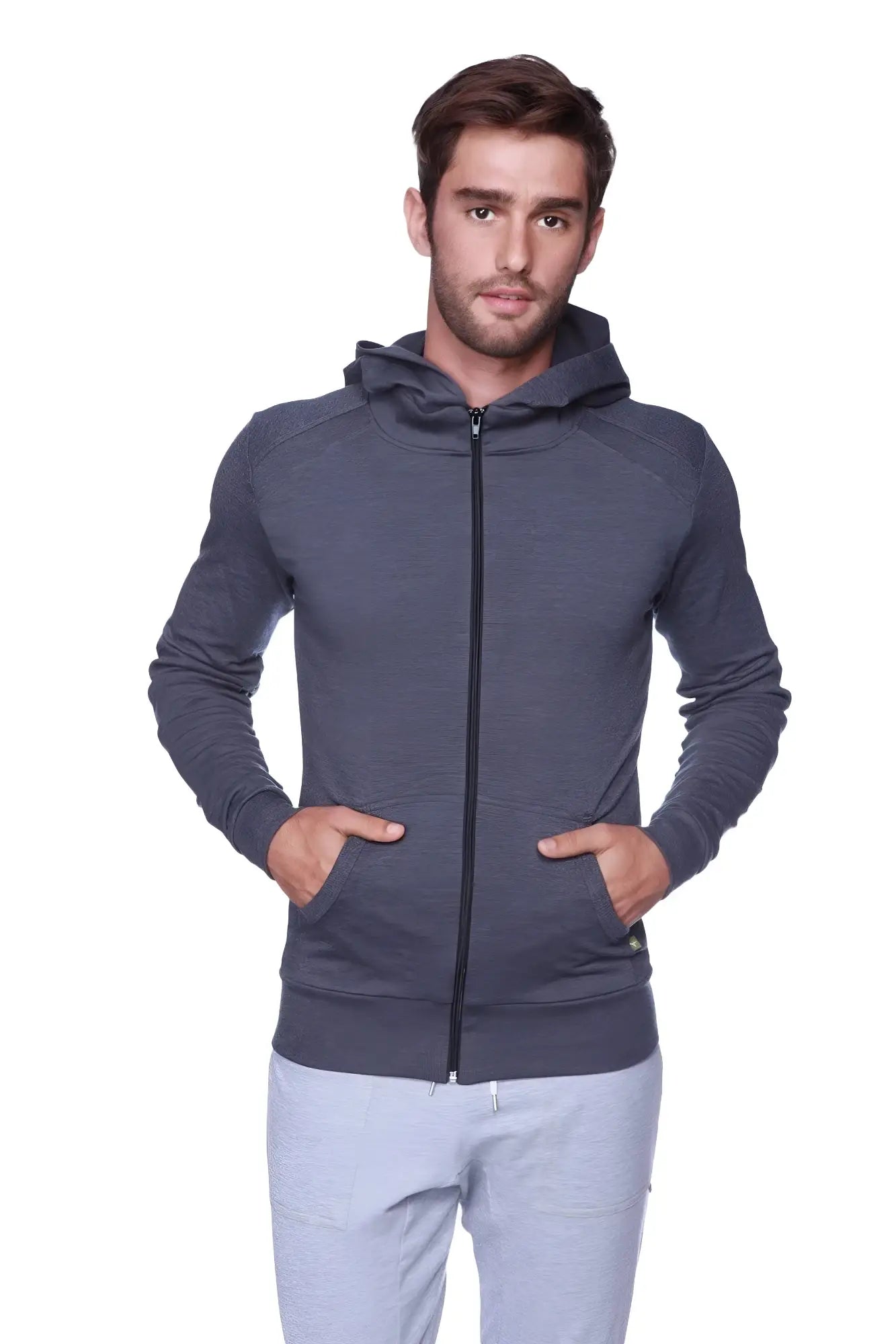 Dark gray form-fit crossover yoga track hoodie with textured fabric and black zipper for performance wear