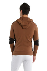Form-fit crossover yoga track performance hoodie in chocolate brown with black contrast panels on shoulders and sleeves