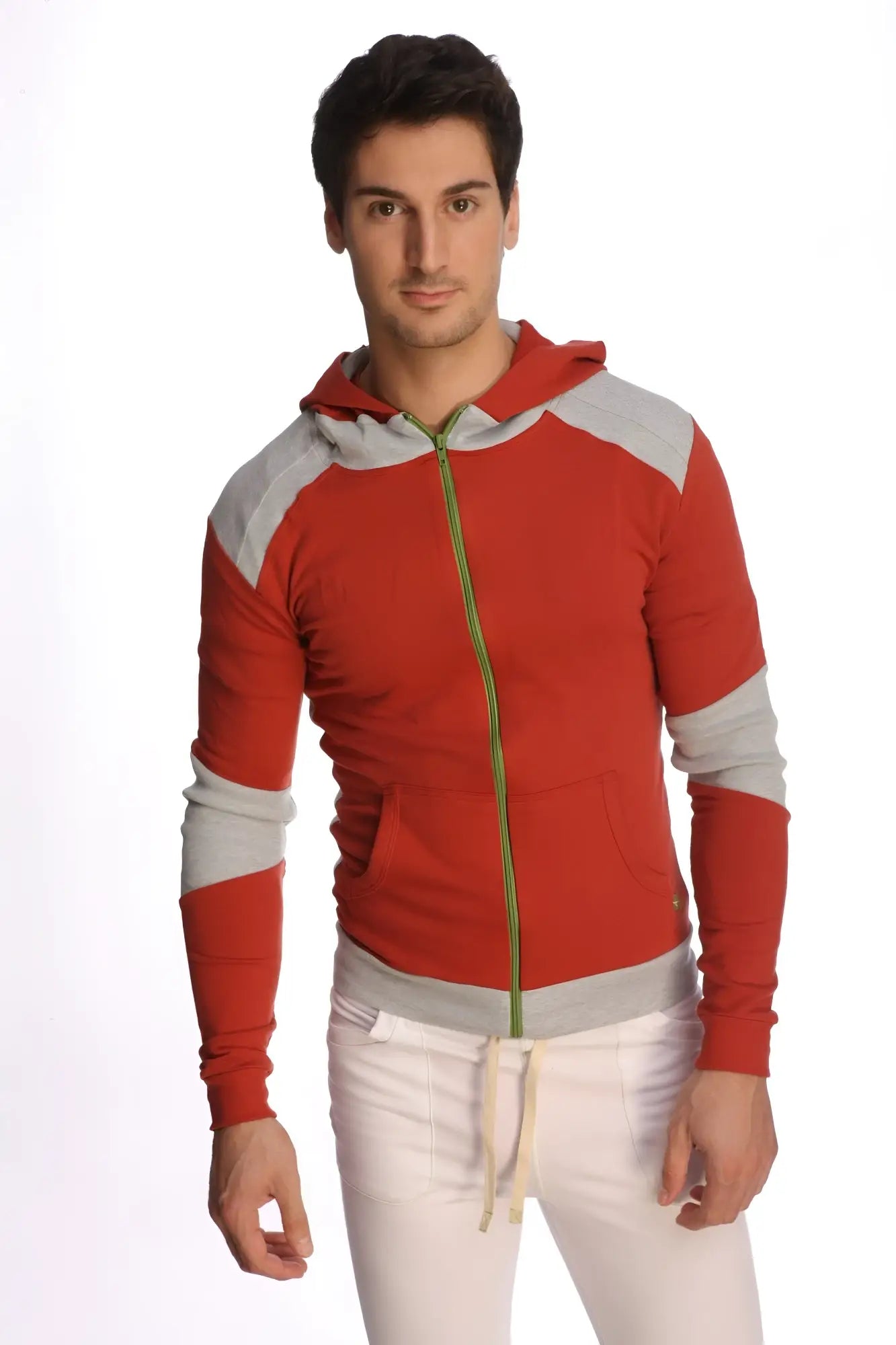 Form-fit crossover yoga track performance hoodie in cinnabar grey with red and gray zip-up design and green zipper