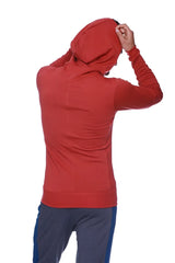 Form-fit crossover yoga track performance hoodie in solid cinnabar red with long sleeves and subtle seam detailing