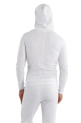 Form-fit crossover yoga track performance hoodie in white with green zipper featuring sleek long sleeves and a hood