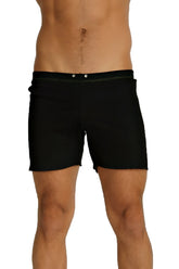 Black fusion yoga short swim trunks with sleek minimalist design and subtle white stitching along the waistband
