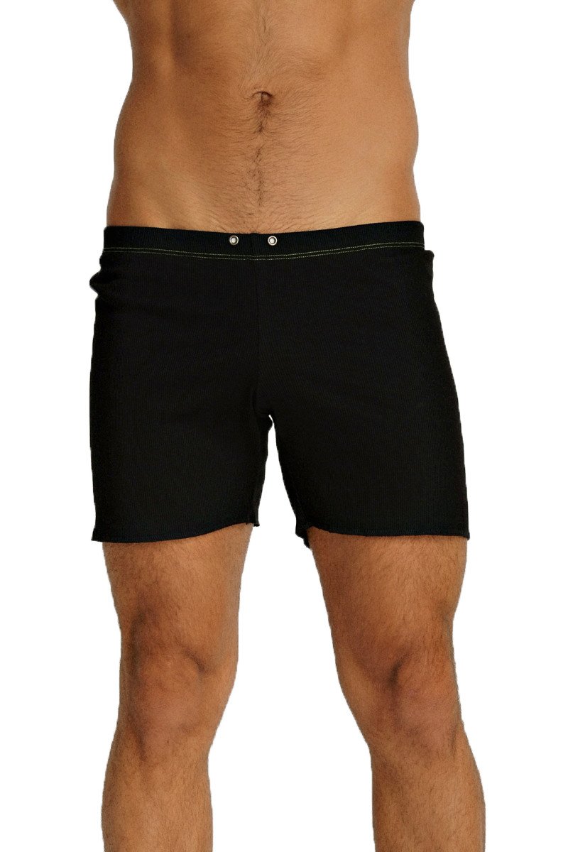 Black fusion yoga short swim trunks with sleek minimalist design and subtle white stitching along the waistband