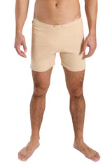 Beige fusion yoga short in form-fitting smooth fabric with subtle front seam detail ideal for swim or activewear