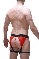 Red lace g-string Lurris lace red with black elastic waistband and leg straps shown from the back side