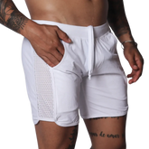 White athletic shorts with a drawstring waistband and side panels made of breathable mesh fabric.