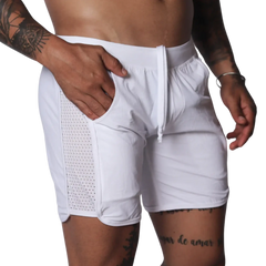 White athletic shorts with a drawstring waistband and side panels made of breathable mesh fabric.
