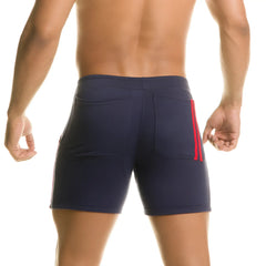 Back view of navy blue Gigo Chari athletic shorts with red side stripes and two back pockets for casual wear