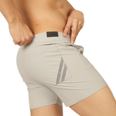 Beige gigo club gray athletic shorts back side with reflective diagonal stripes and black brand patch at waistband