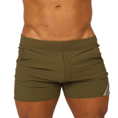 Olive green gigo club athletic shorts with snug fit and subtle white side stripes for active wear