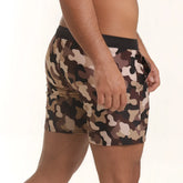 Camouflage patterned men’s shorts with a black elastic waistband from gigo combat brown beachwear collection