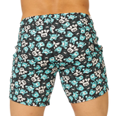 Black swim trunks by gigo comics beachwear with turquoise and white cartoon monster pattern for beach use