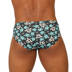 Black gigo comics swimbrief swim trunks with playful turquoise and white cartoon shark pattern for beachwear