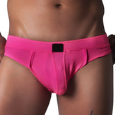 Fuchsia textured mesh jockstrap brief with a wide waistband and a central black logo patch.