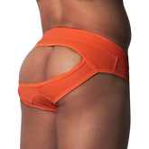 Bright orange jockstrap in textured athletic mesh with a wide waistband and an open-back design.