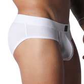 White athletic-style briefs made from textured, breathable mesh fabric with a thick waistband and contoured pouch.