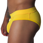 Bright yellow low-rise brief in textured, breathable honeycomb mesh fabric with a wide supportive waistband.