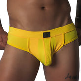 Bright yellow, textured mesh brief with a supportive pouch, tonal piping, and a small black rectangular logo patch.