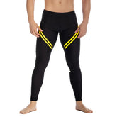 Black gigo core leggings with bold yellow diagonal stripes on outer thighs for athletic performance