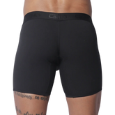 Solid black fitted boxer trunks with a wide, tonal branded elastic waistband.