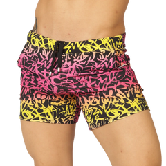 Gigo Crazy Beachwear vibrant graffiti-patterned swim shorts in bold pink yellow and black with drawstring waistband