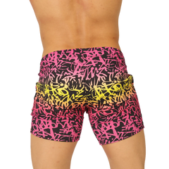 Vibrant gigo crazy beachwear shorts with bold pink and yellow graffiti pattern on black fabric for casual wear