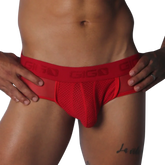 Red mesh jockstrap with a branded elastic waistband, featuring sheer side panels and a supportive contour pouch.