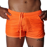 Bright orange athletic mesh shorts with a drawstring waistband and side pockets.