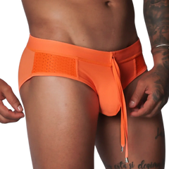 Bright orange swim brief with mesh side panels, an elastic waistband, and a decorative front drawstring tie.