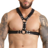 Black leather Gigo fetish harness with silver metal studs and rings designed for edgy fashion and bdsm use