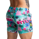 Gigo Figure Beachwear vibrant graffiti-patterned shorts in teal pink and white with bold style text and brand logos