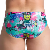 Vibrant turquoise gigo figure swim brief featuring playful lego character with bold pink blue and green graffiti splatters