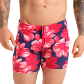 Gigo Flowers fuchsia beachwear vibrant pink and white hibiscus swim trunks with navy fabric and matching drawstring waistband