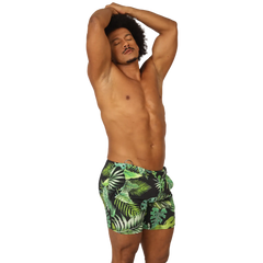 Men’s black swim trunks with vibrant green and lime tropical leaf pattern from Gigo Forest Beachwear