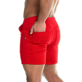 Gigo formal red athletic shorts with a fitted cut, two side pockets, and a small metallic button on the left hip