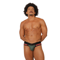 A muscular man with an afro wearing a green black and red gigo garoto athletic brief showing the front side