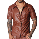 Brown short-sleeve button-down shirt in smooth faux leather with a classic collar and single chest pocket.