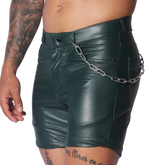Dark green faux leather fitted shorts with a silver chain accessory attached to the waistband.