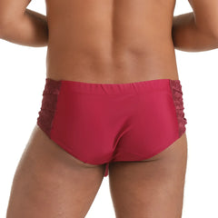 Red lace-trimmed briefs in satin-like fabric designed as gigo hindu wine swim brief for stylish swimwear use