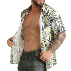 A man wearing a gigo jungle shirt short-sleeved button-up with green white and black leaf pattern