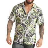 A men’s short-sleeved button-up Gigo Jungle shirt with vibrant green gray and white tropical leaf pattern