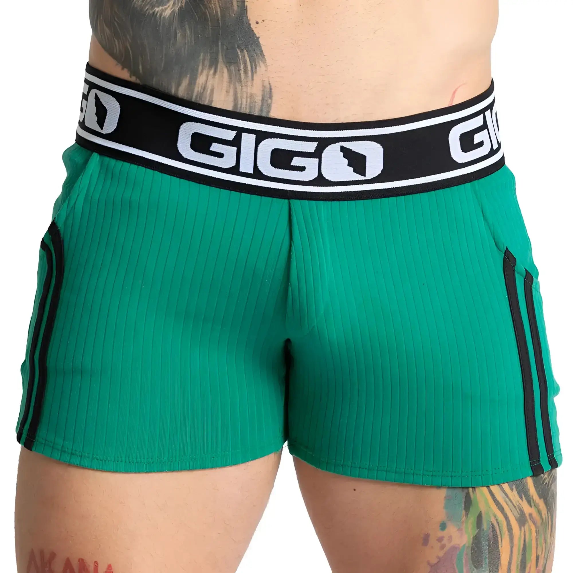 Gigo Khanal green ribbed athletic shorts with black side stripes and branded waistband for active wear