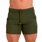 Olive green athletic shorts with drawstring waistband and side pockets from gigo letters green beachwear collection