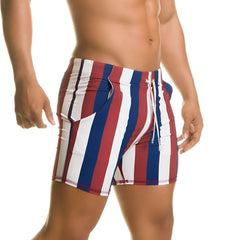 Gigo Line beachwear swim trunks with vertical red white and blue stripes and a drawstring waistband