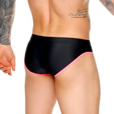 Black gigo medieval candy swim brief with vibrant pink trim along waistband and leg openings for swimwear use