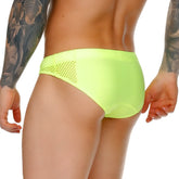 Bright neon green gigo morocco yellow swim brief with mesh side panel designed for comfortable swimming use