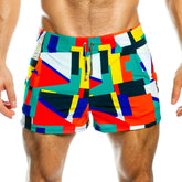 Gigo multicolor beachwear vibrant geometric patterned swim trunks in red teal yellow and navy blue for summer use