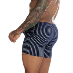 Navy blue and white vertically striped men’s boxer briefs with button closure from gigo naval blue beachwear