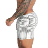 Black and white vertically striped men’s shorts made of stretchy fabric with drawstring waistband