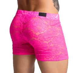 Bright pink lace men’s shorts with a floral pattern and black brand patch on the waistband from Gigo Paradise